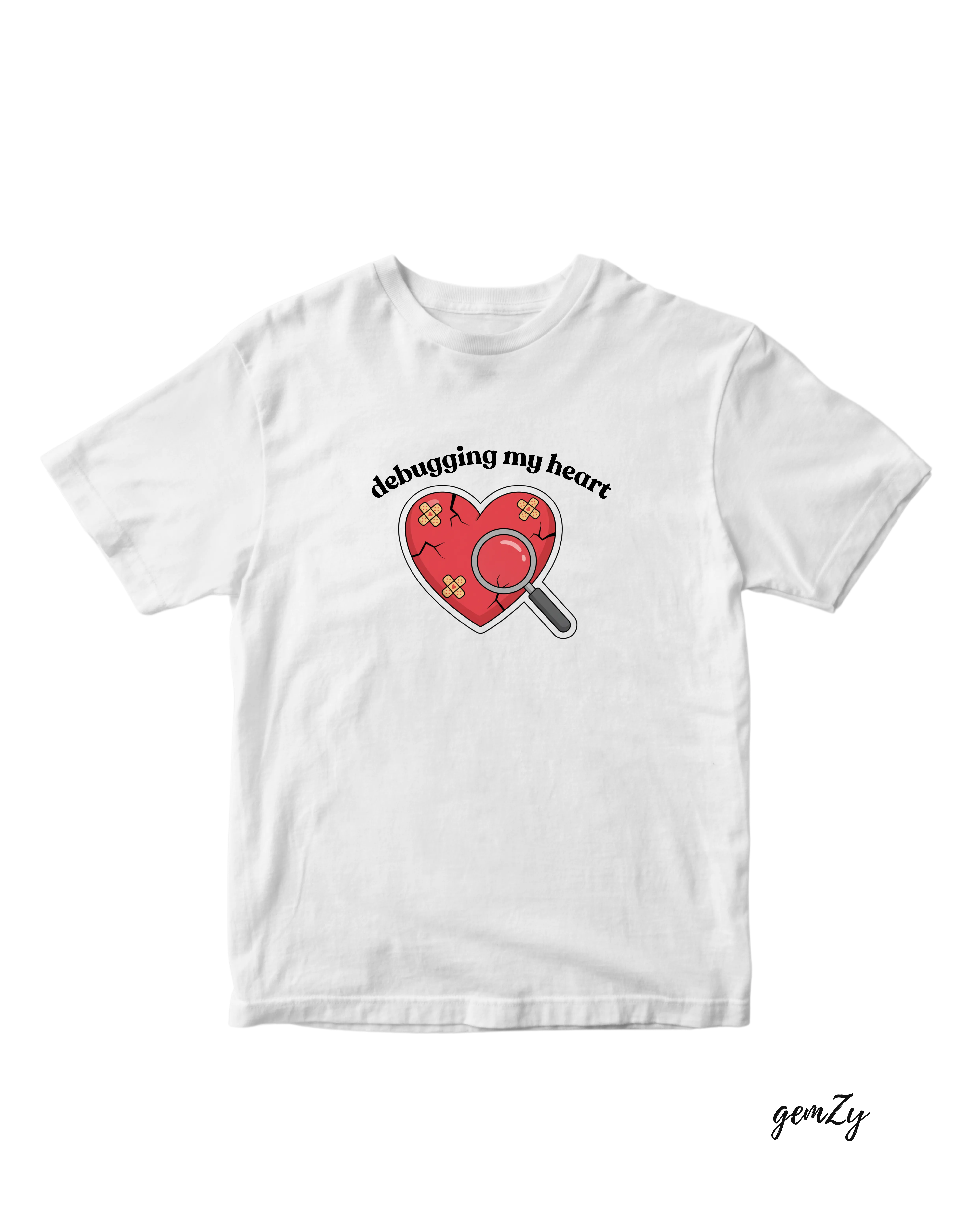 White tee with bandaged red heart and magnifying glass, text reads debugging my heart